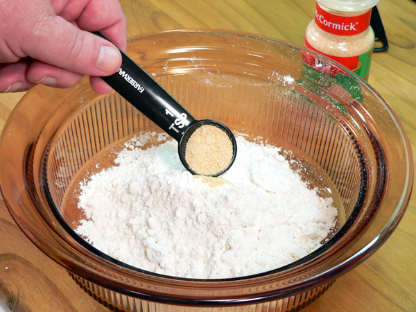 04_Pork-Chops_add-garlic-powder Add the garlic powder.