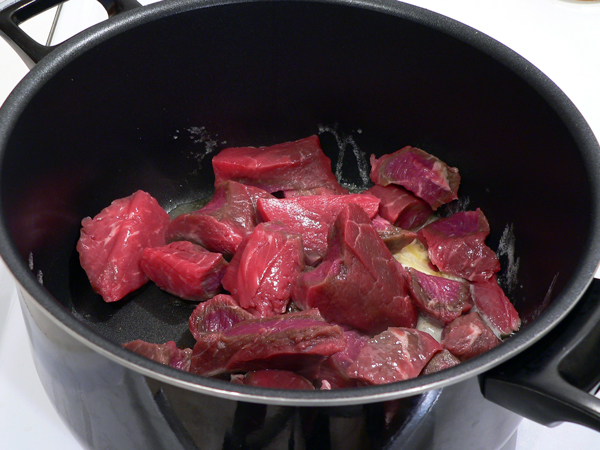 05-Beef-Stew_add-beef Add the beef cuts to the pot.