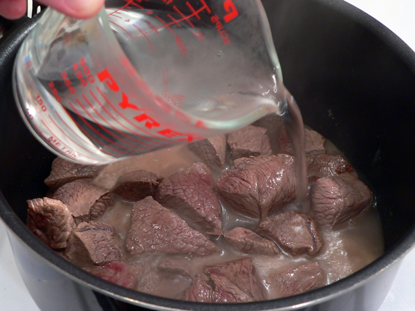 07-Beef-Stew_add-water Add the water.
