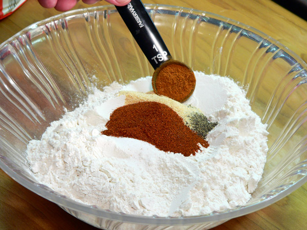 07_Chicken-Fried-Steak_add-cayenne-pepper Add the cayenne pepper.