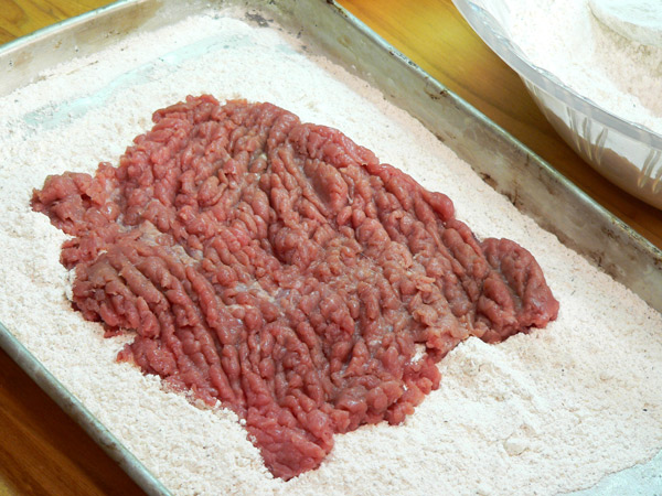 16_Chicken-Fried-Steak_dredge-in-flour Place the steak portions in the flour mixture.