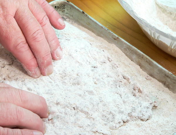 17_Chicken-Fried-Steak_rub-flour-in-well Rub the flour in all the crevices of the steak.