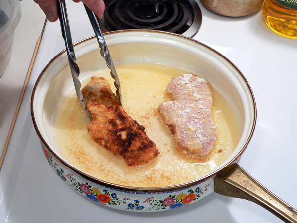 31_Pork-Chops_fry-chops-flip Carefully flip the chops over.