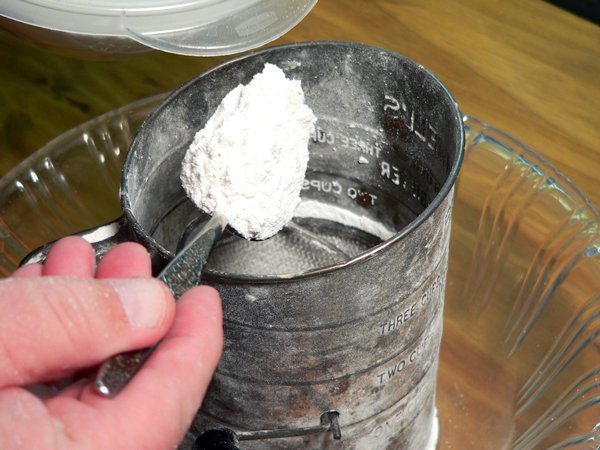 Basic-Pie-Crust_04_spoon-back-into-sifter Basic Pie Crust, spoon the flour back into the sifter.