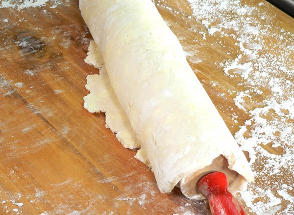 Basic-Pie-Crust_30_roll-onto-rolling-pin Basic Pie Crust, roll the dough onto the rolling pin.