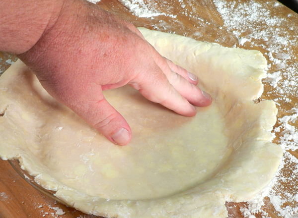 Basic-Pie-Crust_32_press-into-edges Basic Pie Crust, gently press the edges into the corners.