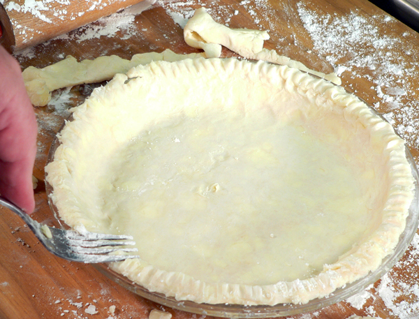 Basic-Pie-Crust_34_fork-around-edges Basic Pie Crust, press a fork around the edges.