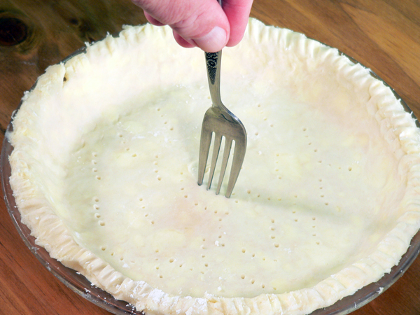 Basic-Pie-Crust_35_fork-around-the-bottom Basic Pie Crust, run the fork around the bottom.