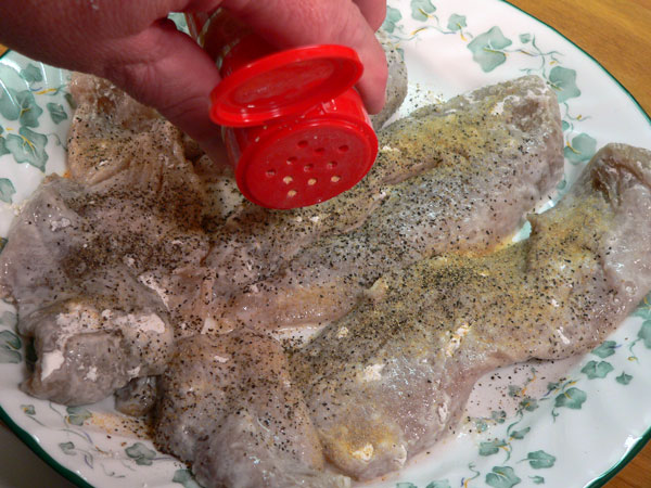 Blue-Fish_13_season-with-garlic-powder Bluefish Recipe, add some garlic powder.