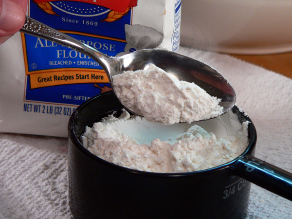Blueberry-Muffins_03_spoon-flour-to-measure Blueberry Muffins, spoon the flour into a measuring cup.