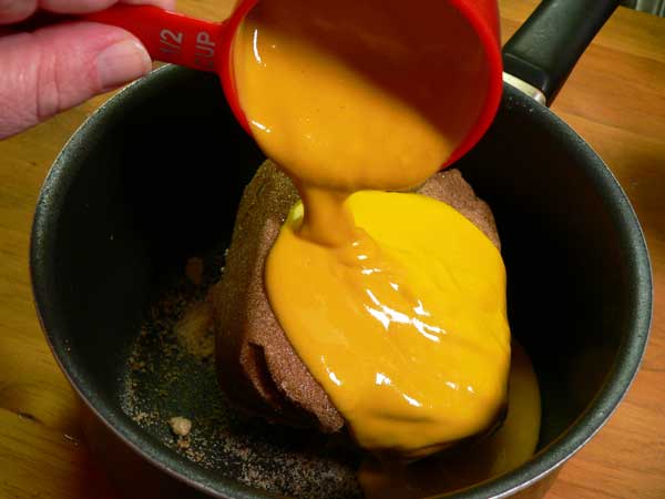 Coca-Cola Glazed Ham, add the yellow mustard.
