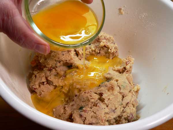 Fruitcake Cookies, add the eggs.