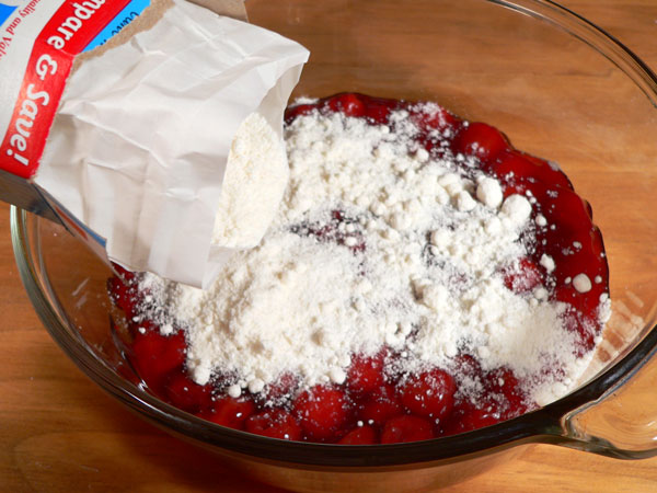 Quick-Cherry-Cobbler_03_add-cake-mix Quick Cherry Cobbler, add the cake mix.
