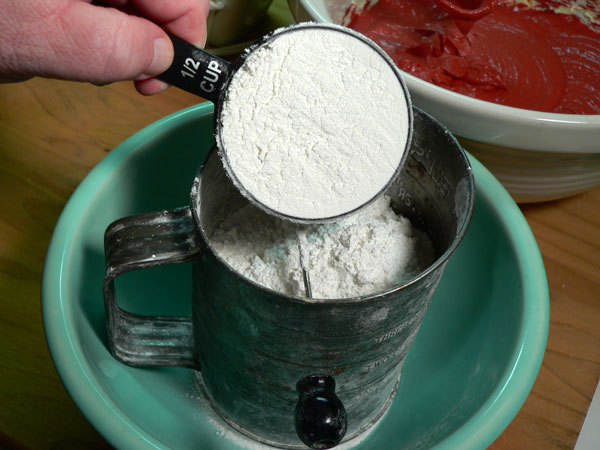 Red Velvet Cake, place flour in sifter again.