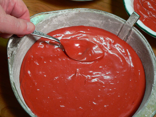 Red Velvet Cake, level it out with a spoon.