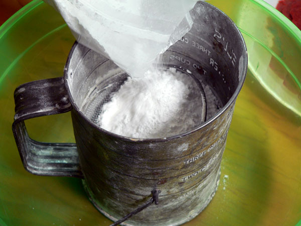 Red Velvet Cake, add confectioners sugar to the sifter.
