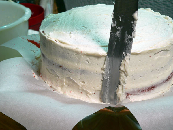 Red Velvet Cake, crumb coat the layers.