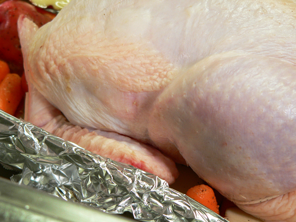Roast Chicken, tuck the wings under the chicken.