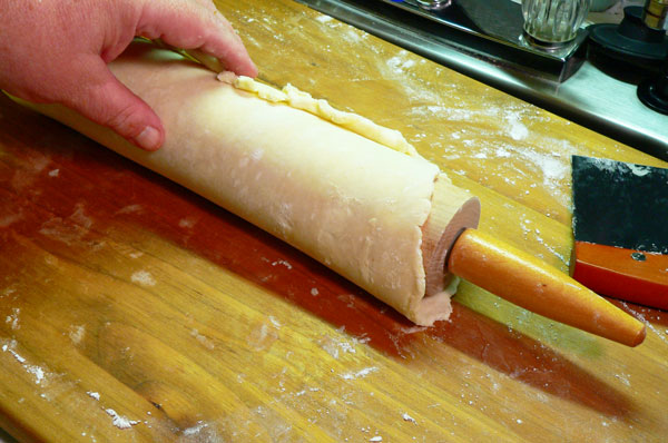 Sweet Potato Pie, roll the dough around the rolling pin.