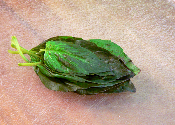 Tomato-Pie_05_stack-basil-leaves Tomato Pie Recipe, stack the basil leaves.